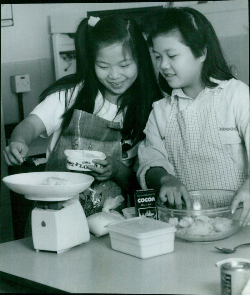 Students from Summertown Middle School show off their culinary skills during a project with Milham Ford Upper School. - Vintage Photograph