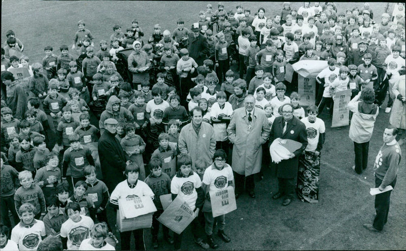 Volunteers in Oxford clean up litter from a beach. - Vintage Photograph