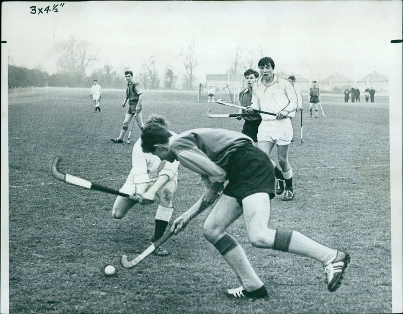 Schoolboys from the East, Midlands, South, and West divisions battle it out in a one-day hockey festival in Oxford on January 9th, 1964. - Vintage Photograph