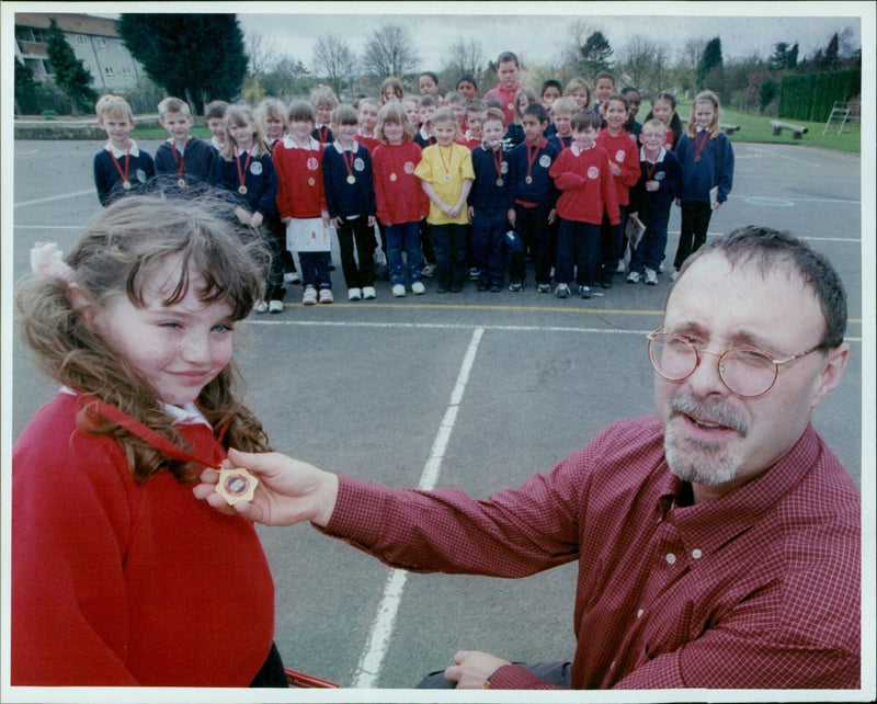 Students from Farm First School receive medals for completing a Readathon challenge. - Vintage Photograph