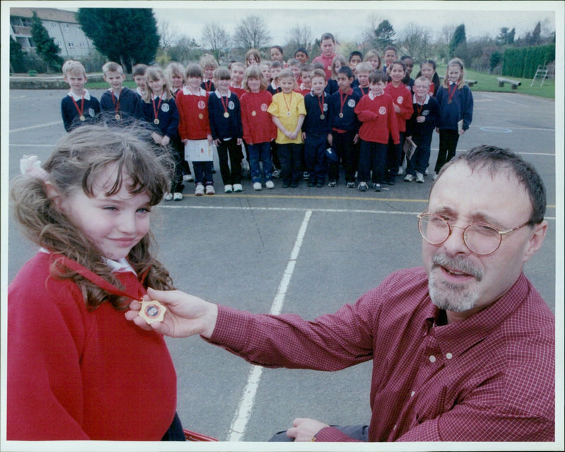 Students of Phil Wood Farm First School receive medals for completing Readathon challenge. - Vintage Photograph