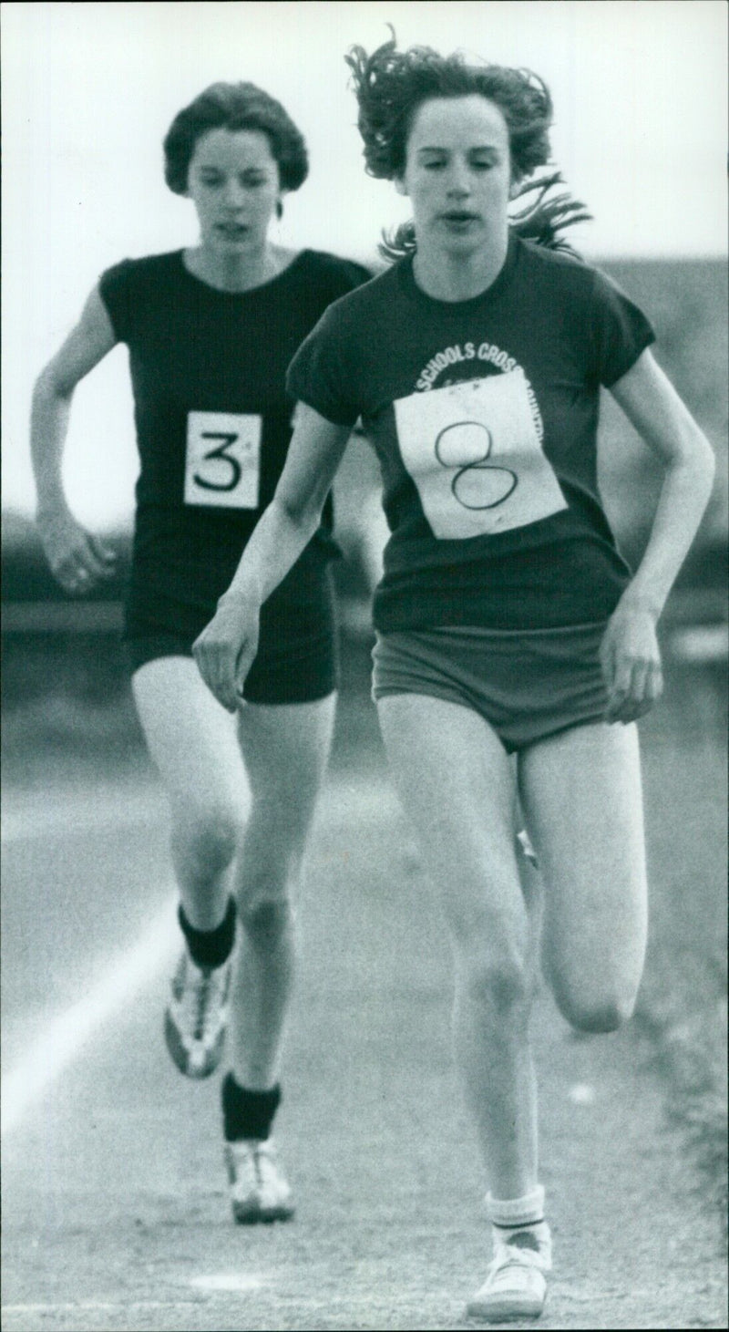 Students from three schools compete in a track and field event. - Vintage Photograph