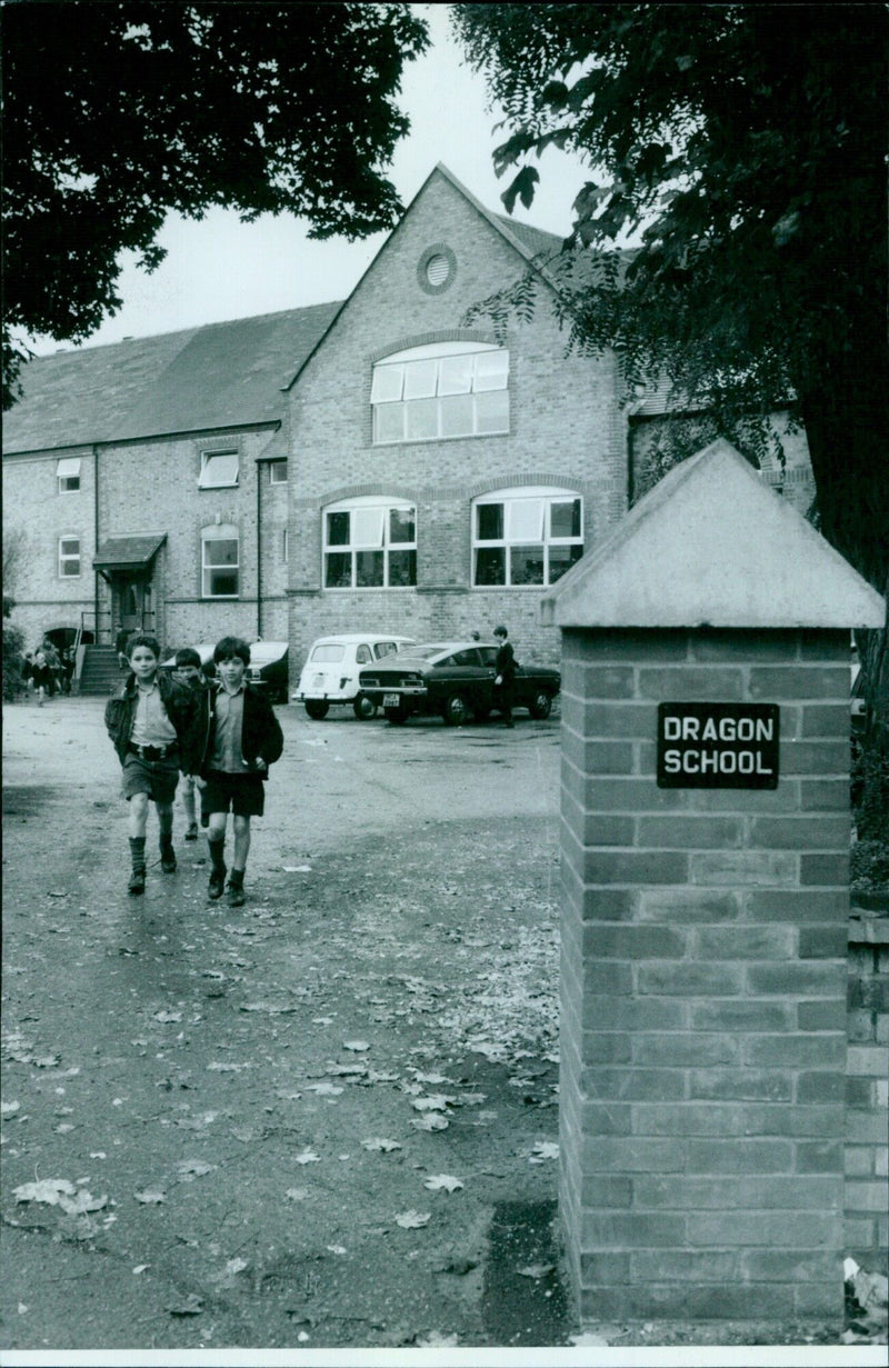 A young student at Dragon School in Abingdon, England, studies the importance of knowledge. - Vintage Photograph