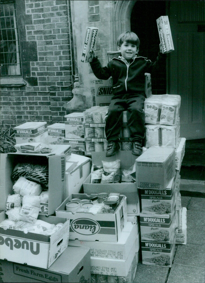 The choir school of Christ Church Cathedral collects food donations for Romania. - Vintage Photograph