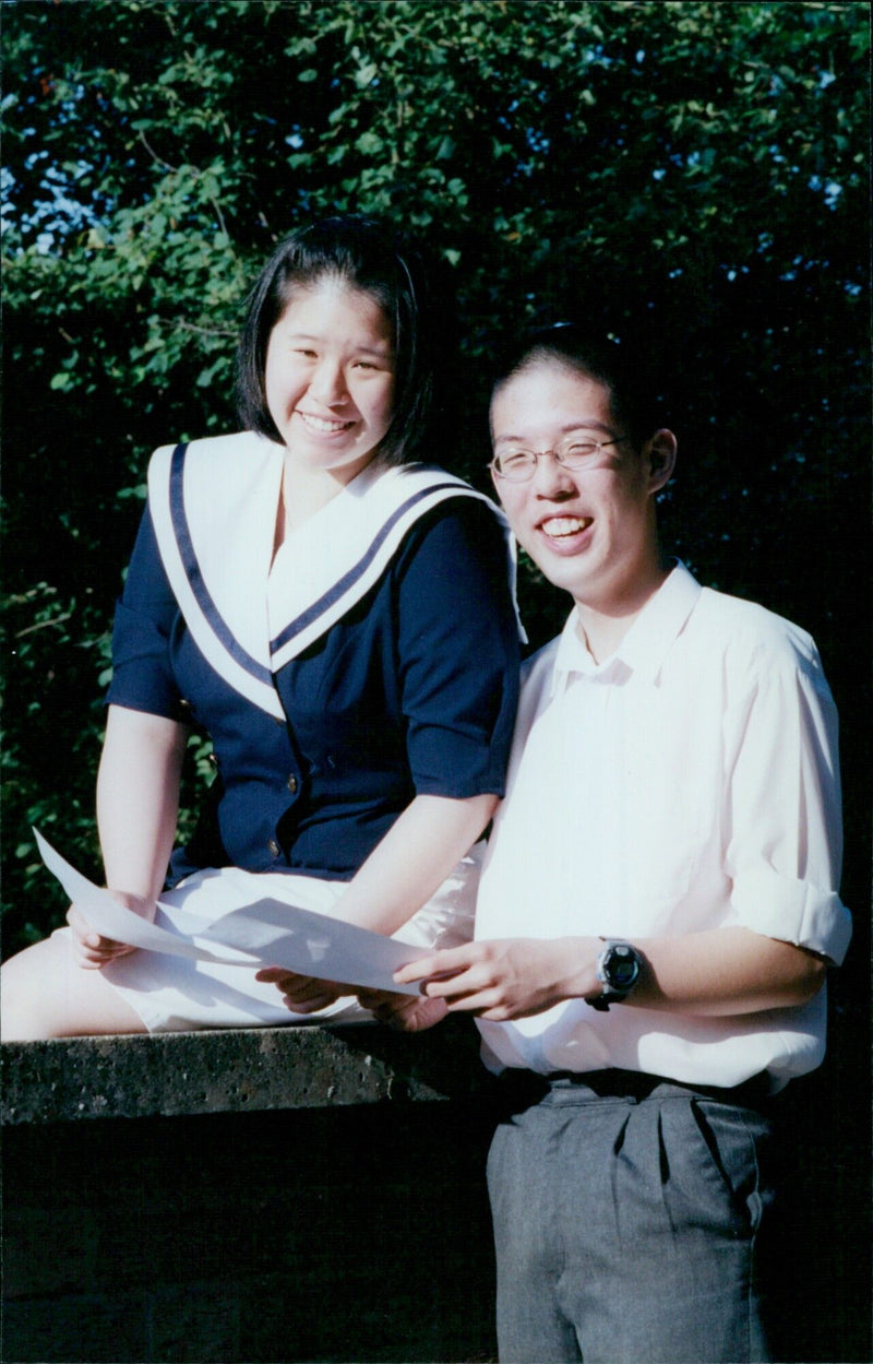 Students Jack O'Sullivan and Ericson Lee celebrate their exam success at St. Augustine's School in Iffley, Oxfordshire. - Vintage Photograph