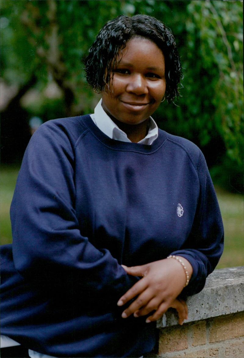 Jasmin, a 16-year-old student at St Augustine's School, has achieved perfect attendance for five years. - Vintage Photograph