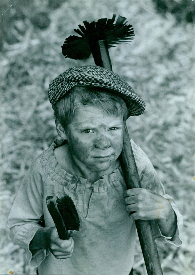 James Wilson, seven, brushes up on history at the St Ebbe's School Victorian fete. - Vintage Photograph