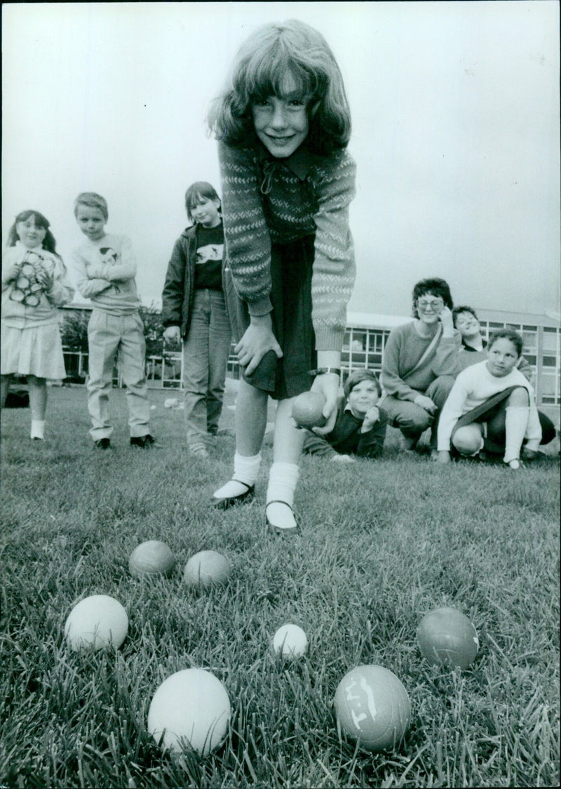 Emma Ferrant, 10, playing boules during Sport Aid day at Wesley Green Middle School. - Vintage Photograph