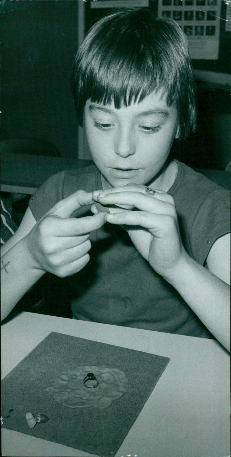 Twelve-year-old Morris polishing a stone for a ring. - Vintage Photograph