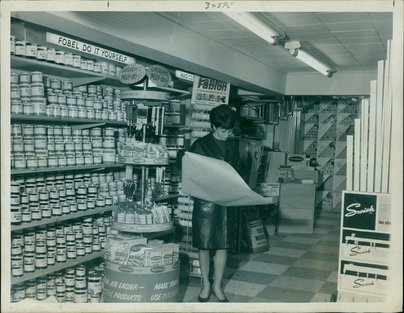 Trade workers installing a new surface at a construction site. - Vintage Photograph