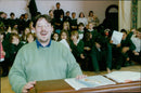 Music teacher Stephen Russen stands with the Wesley Green Middle School choir at Blackbird Leys. - Vintage Photograph