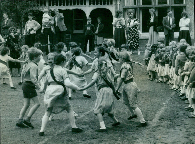 Pupils from Headington School perform a country dance for their parents and fellow pupils. - Vintage Photograph