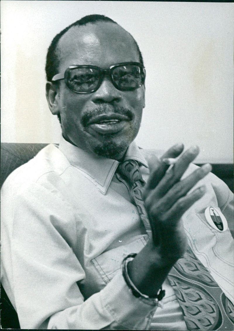 Sir Seretse Khama, President of the Republic of Botswana since 1966, poses for a photo in 1976. - Vintage Photograph