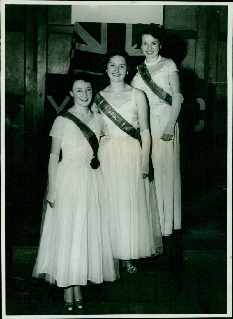 Three young women, Miss Margaret King, Miss Diana Woodley, and Miss Glenda Jones, pose for a photo at a Young Crusaders' social club in Oxford. - Vintage Photograph