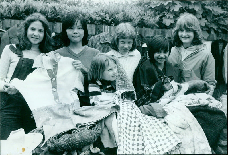 A group of people celebrating during the NOS Dal JOY COMP in the Netherlands on May 24, 1980. - Vintage Photograph