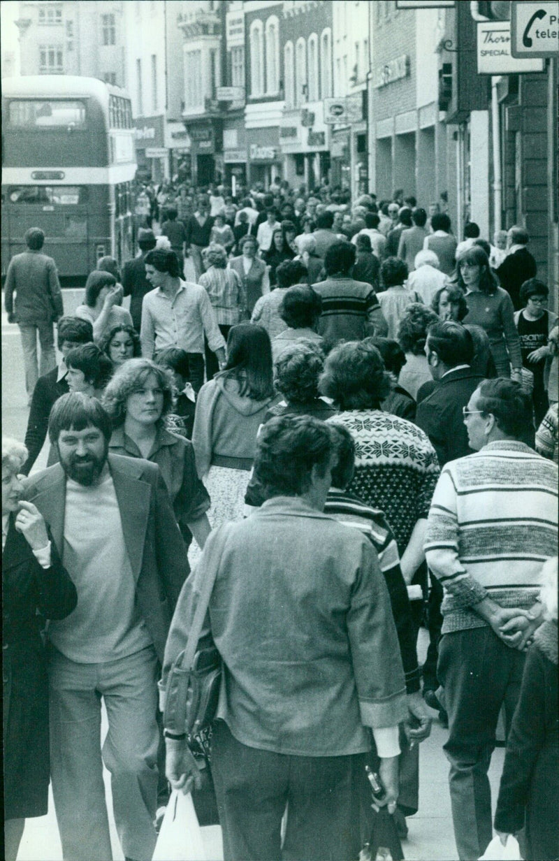 Shoppers taking advantage of a 62% discount on the 1st of June, 1979. - Vintage Photograph