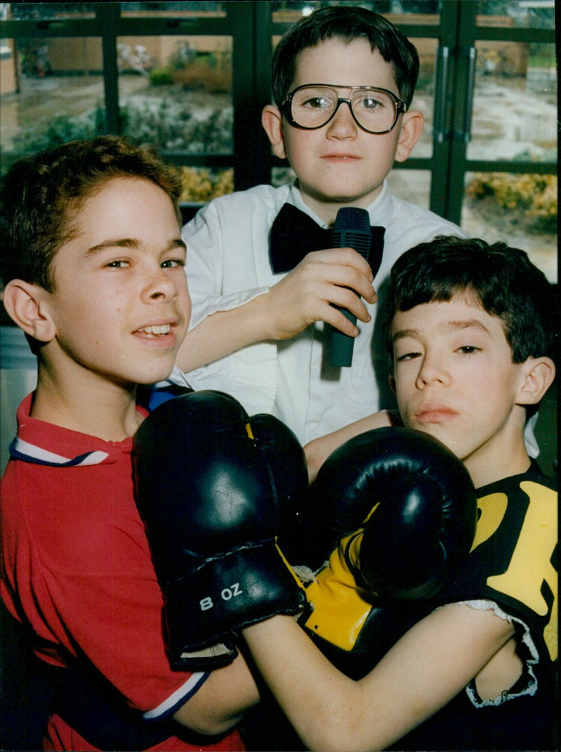 Three students from Cardinal Newman Middle School in Oxford practice boxing. - Vintage Photograph