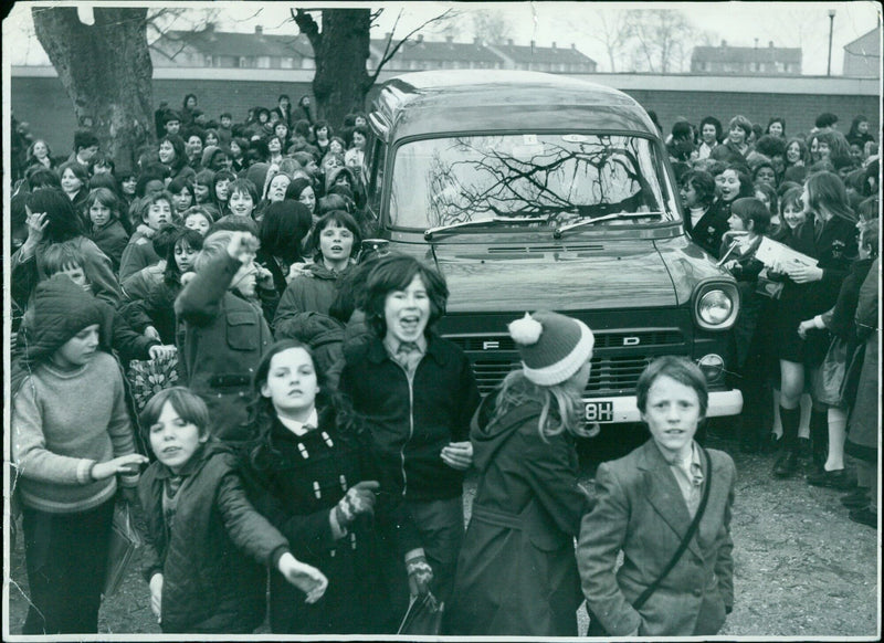 Students arrive at school in a bus. - Vintage Photograph