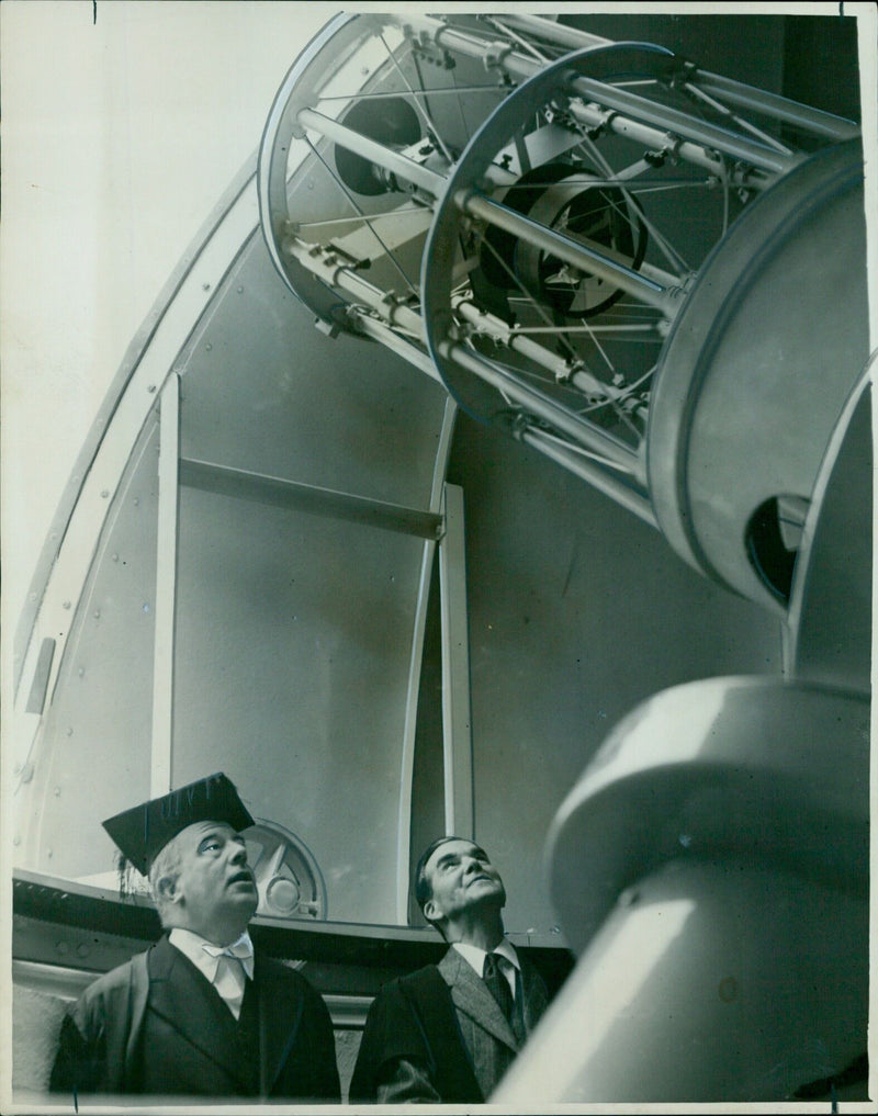 Prof. H. H. Plaskett inspects the newly opened solar tower at the University Observatory, home to one of the largest solar telescopes in the world. - Vintage Photograph