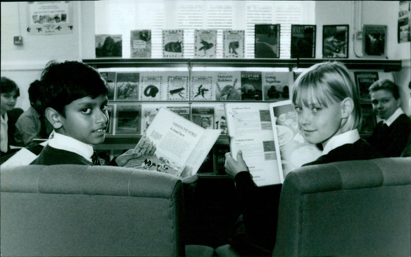 Students at Temple Cowley School in Oxford, England, explore their new library on the opening day. - Vintage Photograph