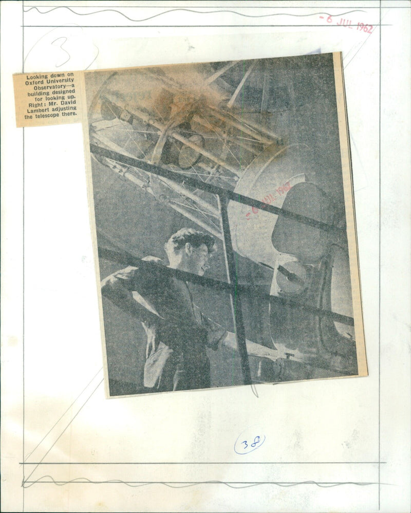 Mr. David Lambert adjusts a telescope at Oxford University Observatory. - Vintage Photograph