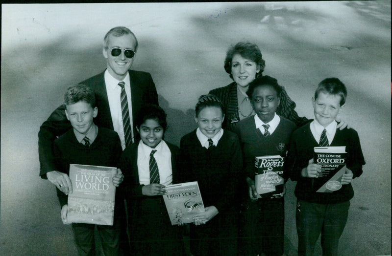 Bainsburys personnel present books to Temple School students and faculty. - Vintage Photograph