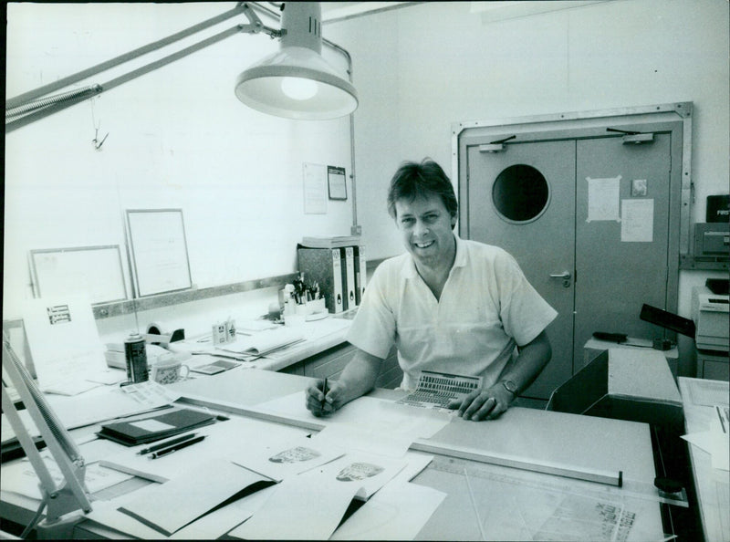 Bob Prescott, experienced commercial designer, stands in his newly established studio after receiving help from the Thames Business Advice Centre. - Vintage Photograph