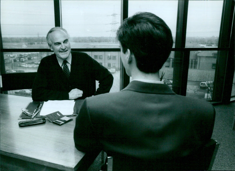 Ais Kim Hills Spedding, Director and Chief Executive of the Thames Business Advice Centre, assists a client with their ideas on October 7, 1994. - Vintage Photograph