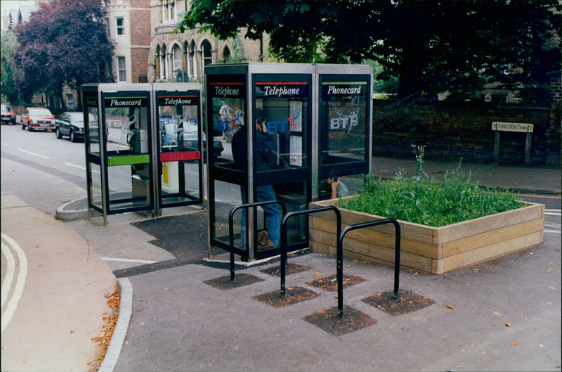 A row of telephone boxes at the junction of Woodstock Road and Bevington Road in Oxford, England. - Vintage Photograph