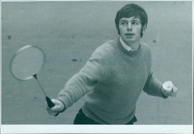 Oxford University Badminton Club captain Martin Crosby playing backhand stroke during practice. - Vintage Photograph