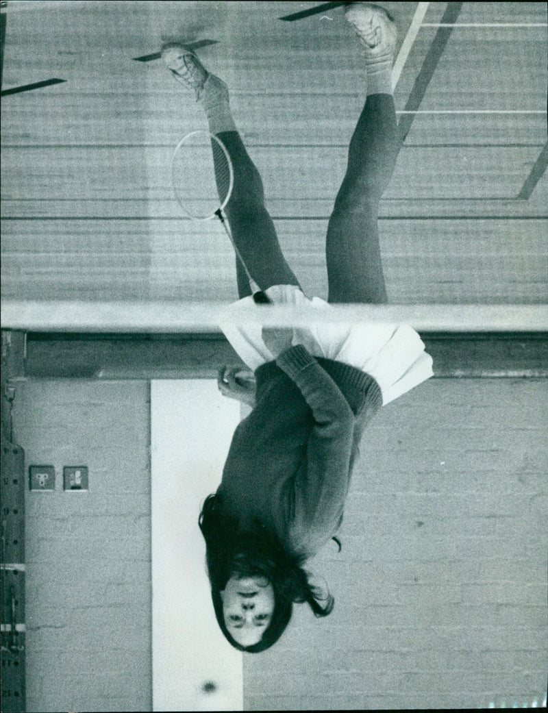 Jane Beighton of Mansfield College playing a forearm shot during a badminton practice session. - Vintage Photograph