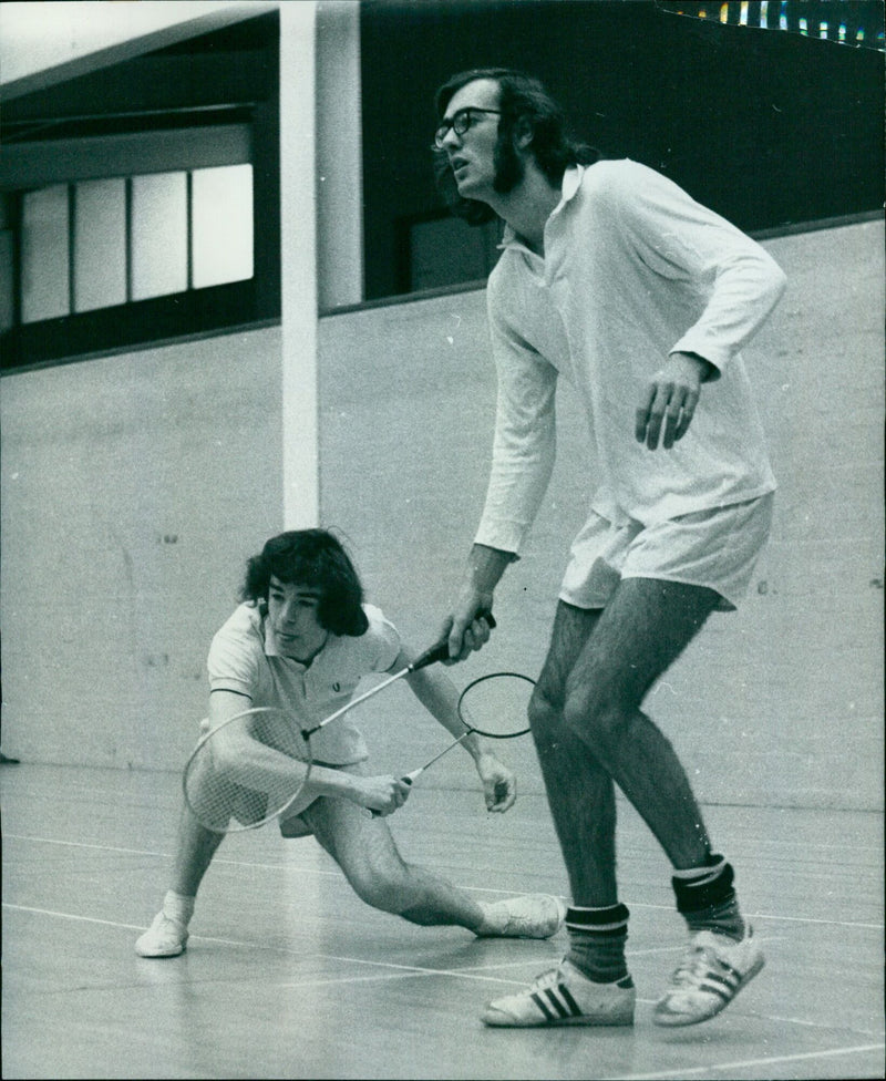 Ian Stowe and Alan Foale (Lincoln) face off against St. Catherine's pair John Bittlestone and Dave Stevens in a Inter-College Badminton League match. - Vintage Photograph