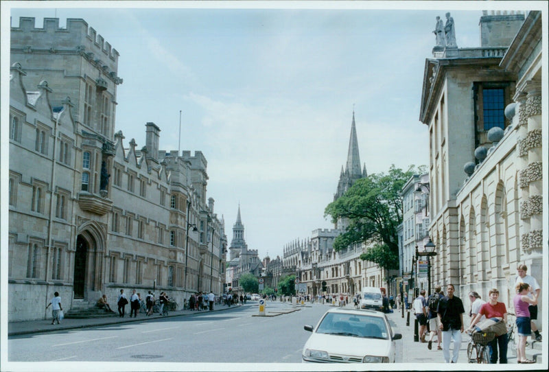 People walking on Oxford High Street in Oxford, UK. - Vintage Photograph