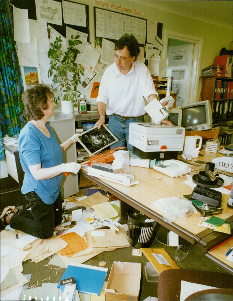 Teacher Beth Staunton and Head Teacher Chris Warner tidy up following a break in and vandalism at Cutteslowe School. - Vintage Photograph