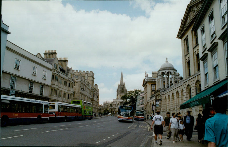 The University Church of St Mary and Merton College are seen from the High in Oxford. - Vintage Photograph