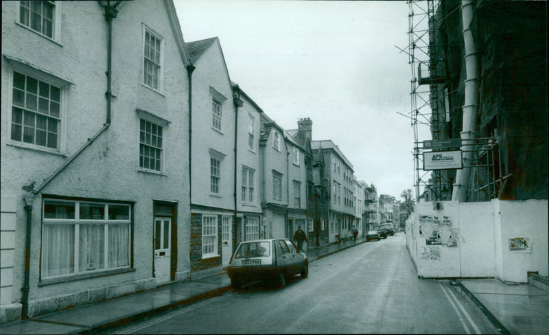 A side-by-side comparison of a modern masonry building in Holywell Street, Oxford, England. - Vintage Photograph