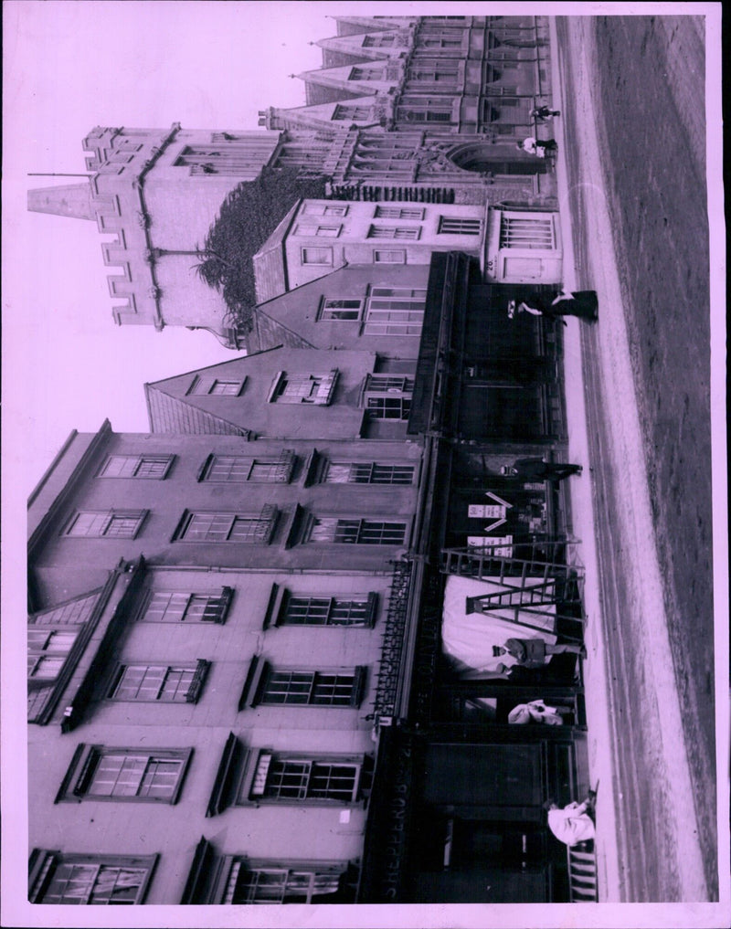 A group of demonstrators march down a street in a protest against police brutality. - Vintage Photograph