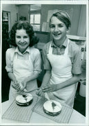 A model poses in a studio wearing a body leotard and paper exposure flash. - Vintage Photograph