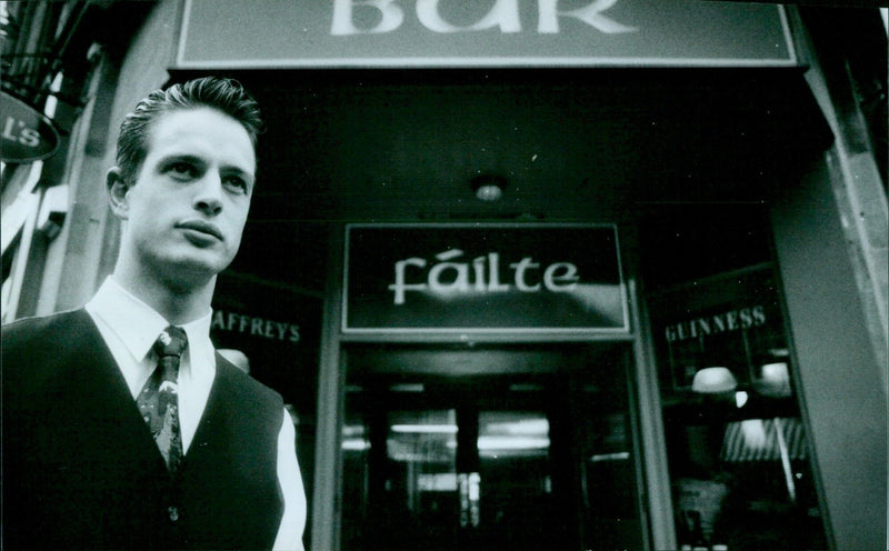 Manager James Knox stands outside O'Neils Bar in Oxford, England on February 27, 2021. - Vintage Photograph