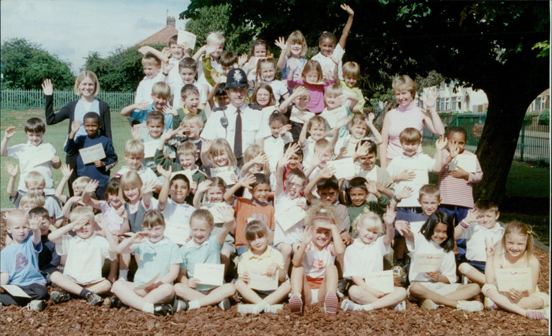 Students at Oxford Church Cowley St James School receive road safety certificates from PC Dave Cooper. - Vintage Photograph