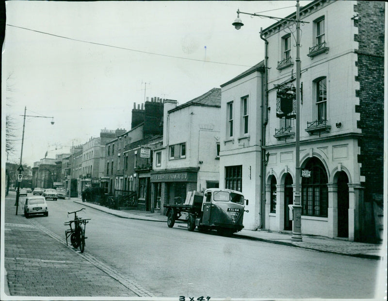 Farmer Proce Wales Morreles of United Counties Farmers Ltd. stops at Walton Street, Crewind, on Thursday, April 16th, 1964. - Vintage Photograph