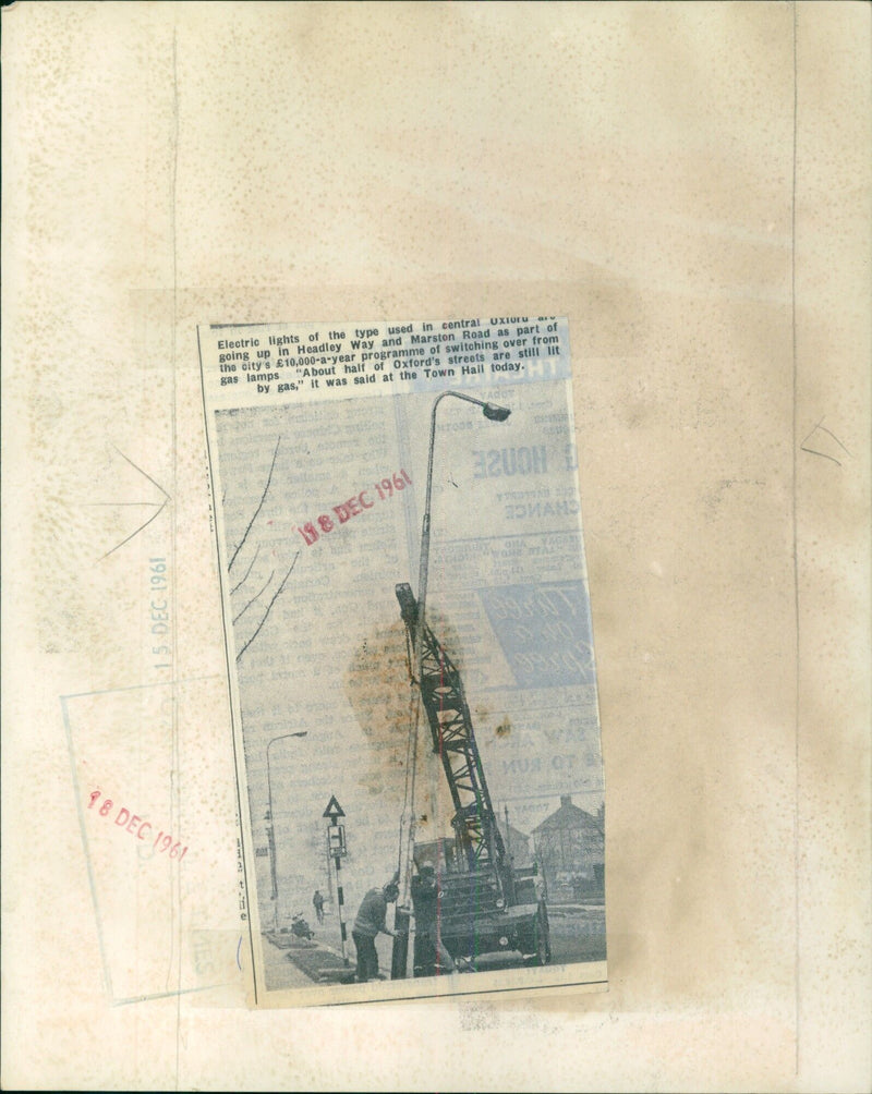 Electric lights being installed in Oxford, UK, as part of a £10,000-a-year programme. - Vintage Photograph