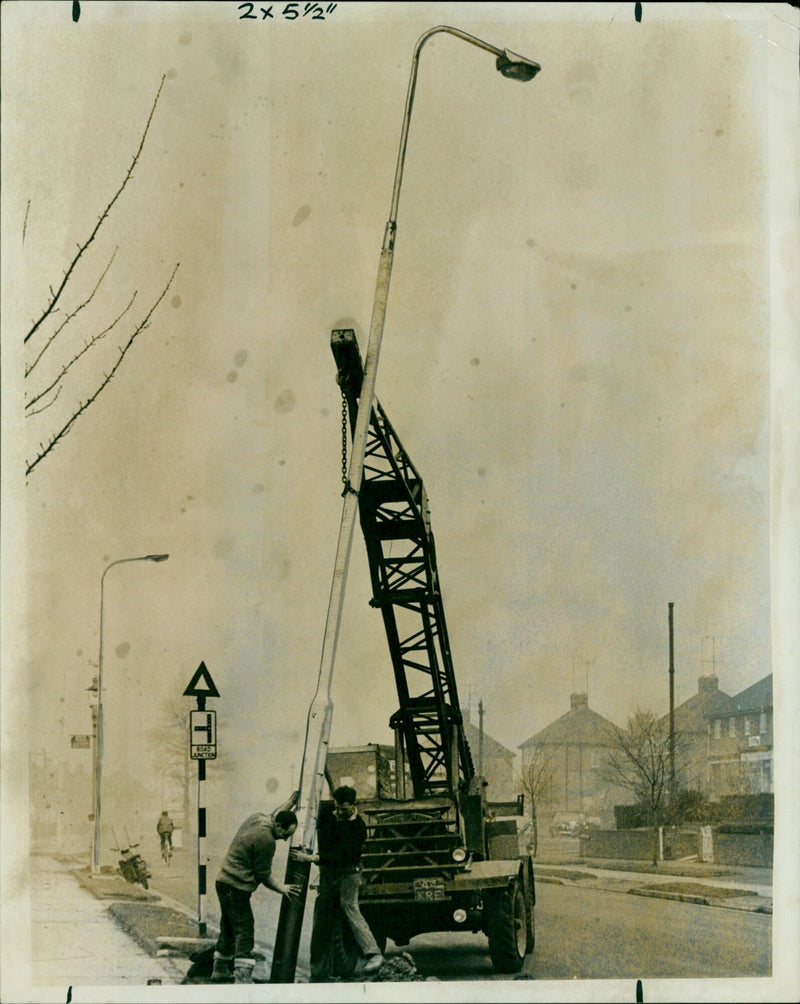 Electric lights being installed in Oxford, UK, as part of a £10,000-a-year programme. - Vintage Photograph