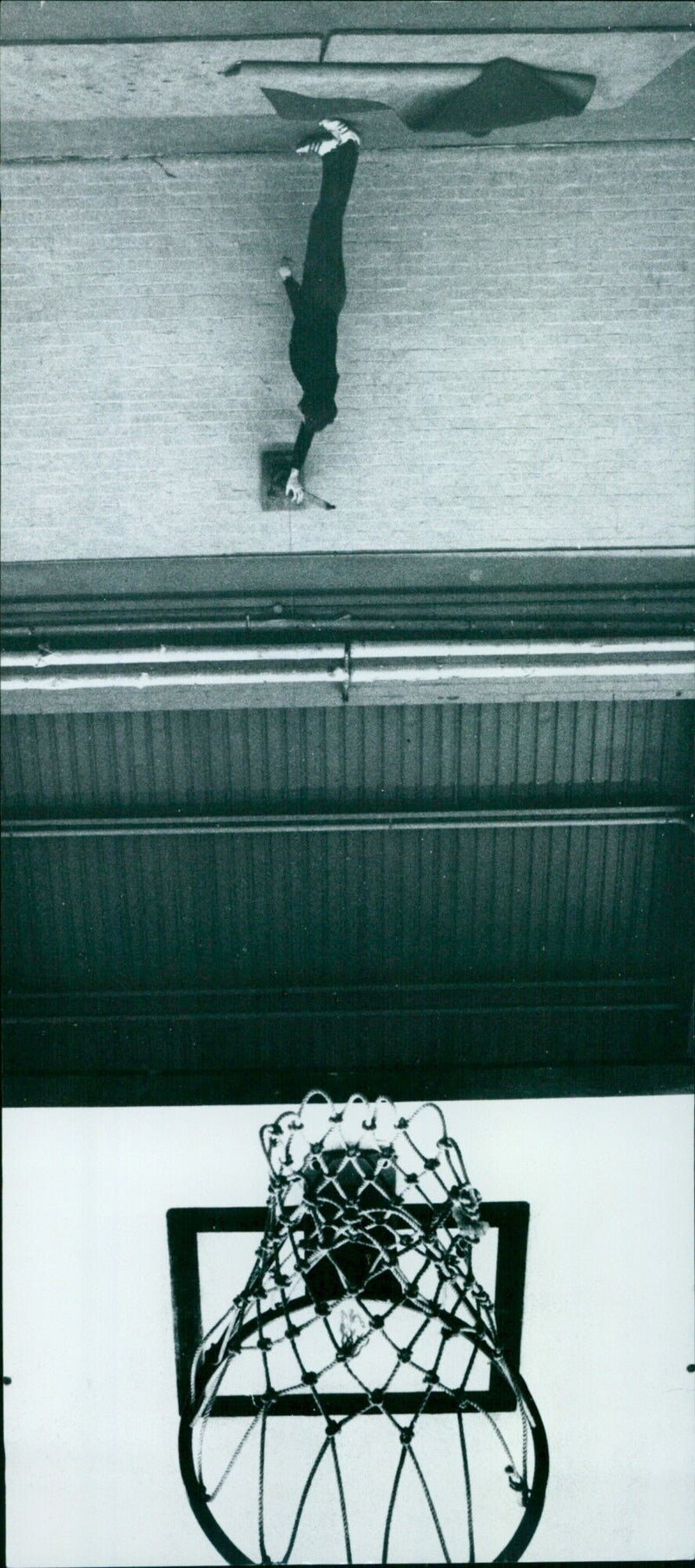 A man in a red office takes a phone call. - Vintage Photograph