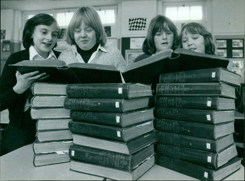 Four students at Temple Cowley School consider a free offer of the 1930s. - Vintage Photograph