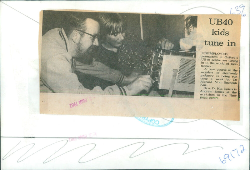 Dr. Richard Von Sucnouk Kur instructs Andrew James on electronic gadgetry at the UB40 centre in Oxford. - Vintage Photograph