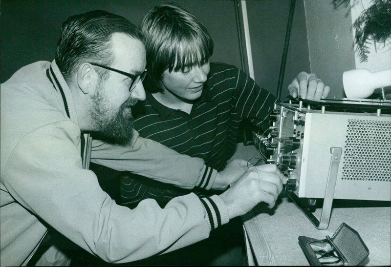 Dr. Richard Von Sucnouk Kur instructs Andrew James on electronic gadgetry at the UB40 centre in Oxford. - Vintage Photograph