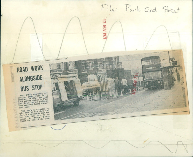 Post Office engineers carrying out cable work near a bus stop at an old LMS railway station in Park End Street. - Vintage Photograph