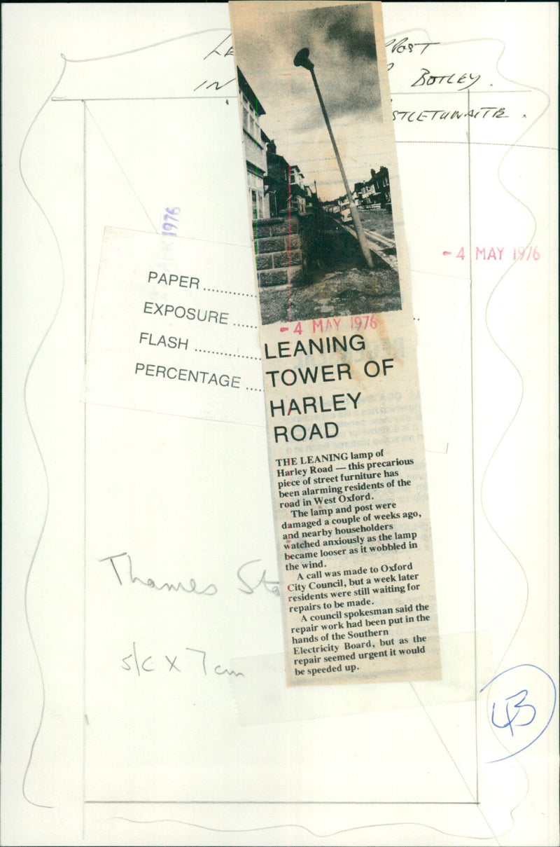 A damaged street lamp leans precariously on a post in West Oxford. - Vintage Photograph