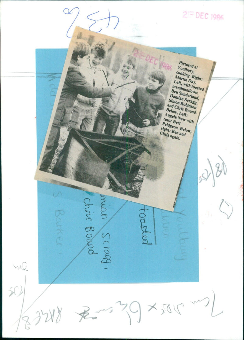 Four friends enjoy toasted marshmallows over a campfire at Youlbury. - Vintage Photograph